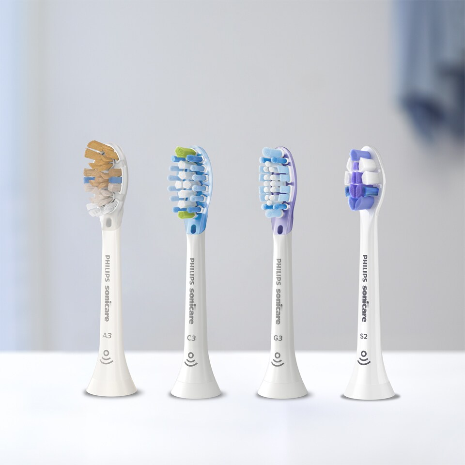 Sonicare brush heads aligned on a countertop