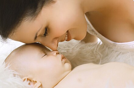 mother with baby smiling