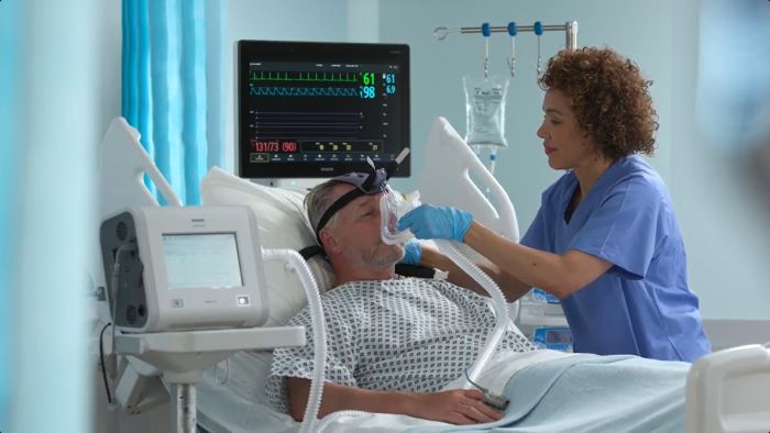 Patient hospitalisé dans son lit