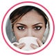 Profile image of brunette woman leaving review, drinking from white mug.