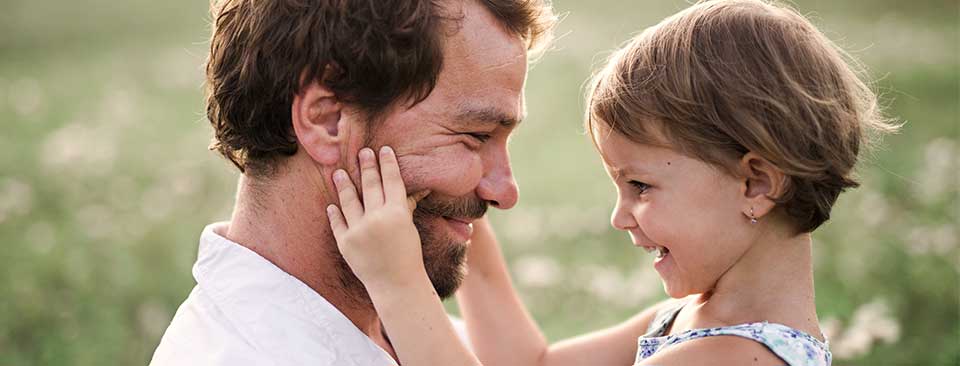 a man holding a child