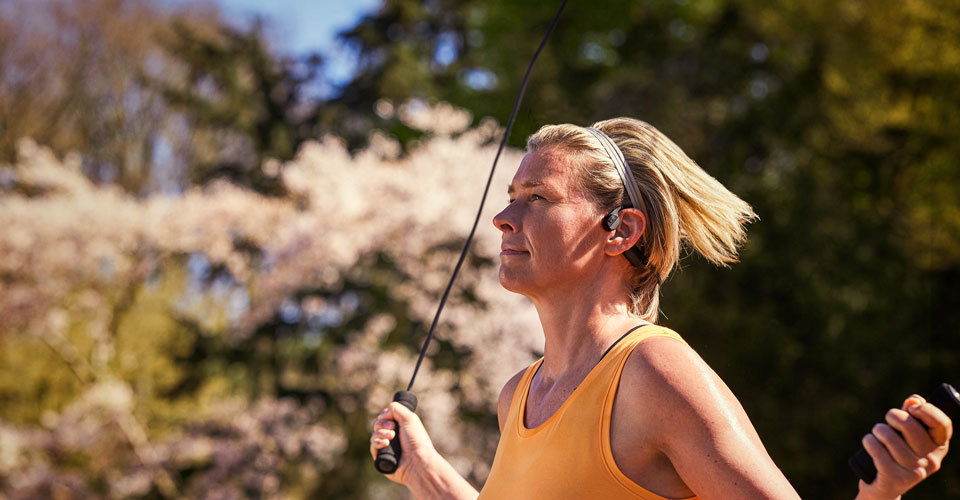 Athlete using bone conduction headphones