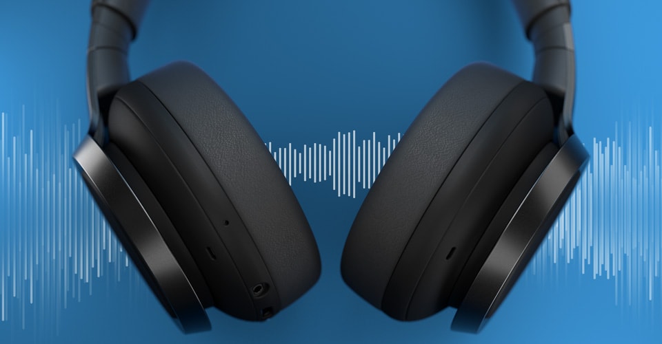 Noise cancelling headphones with sound waves background.