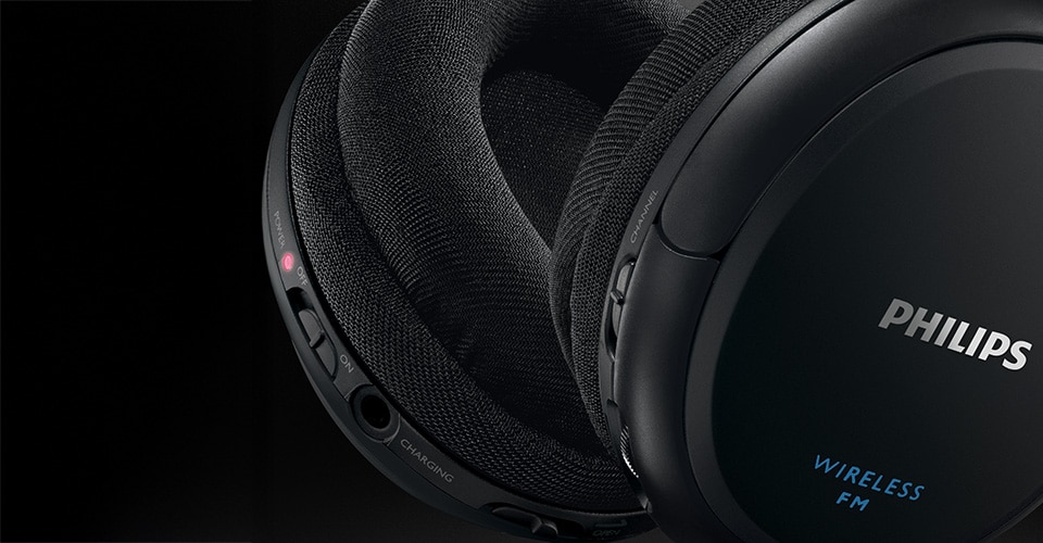 Close-up of Philips SHC5200 headphone controls and ear cushions