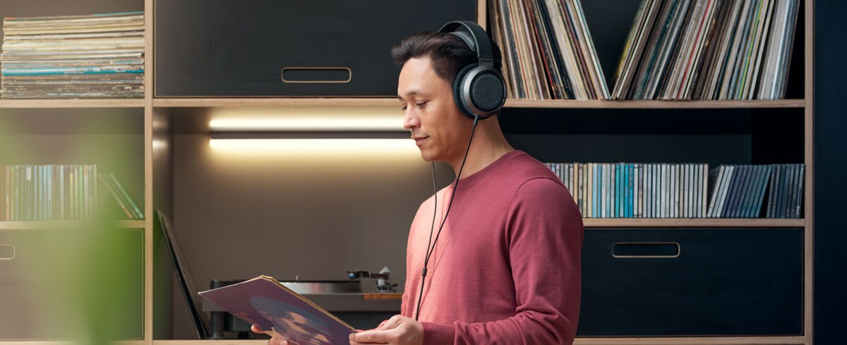 A man listening to music using Philips X3 headphone