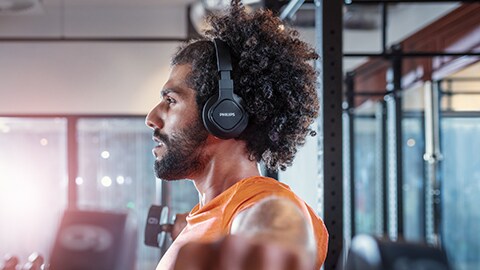 The man using Philips headband sports headphones at gym