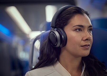 Woman enjoying Noise Cancelling Pro+ with Philips L4 headphones