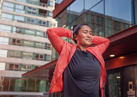 Woman using Philips A5508 wireless headphones outdoor