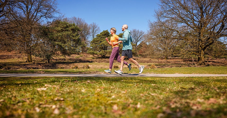 Athletes running with Philips headphones