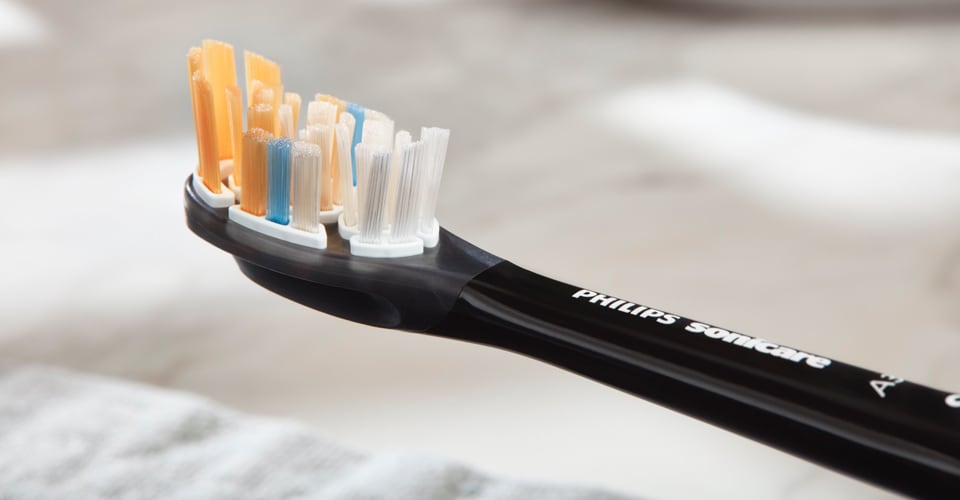 Close-up product shot of the Philips Sonicare A3 Premium All-in-One brush head.
