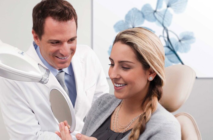 Dentist with female patient