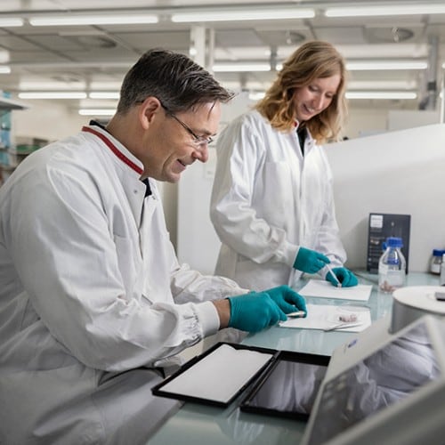 A patient talking to a dental professional with a Philips Zoom! WhiteSpeed lamp in the background