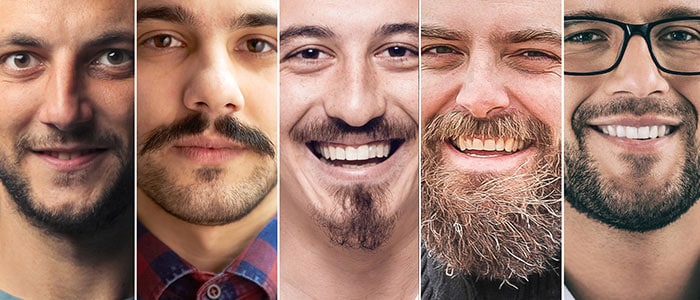 Collage of portraits of seven men with different beard styles looking and smiling at the camera.