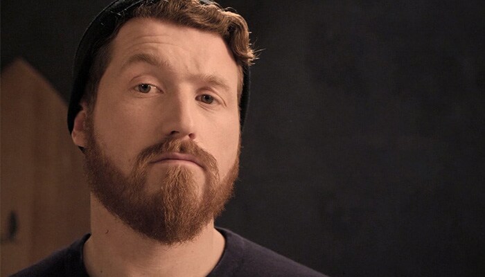 Close-up of a man with a goatee and black knitted cap.