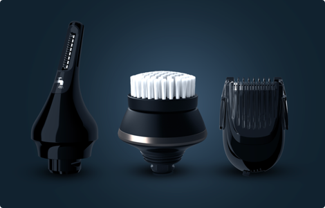 A photograph of three men’s electric shaver accessories: a comb attachment, a brush attachment and a precise shaver head