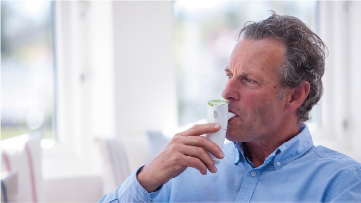 Man using inhaler